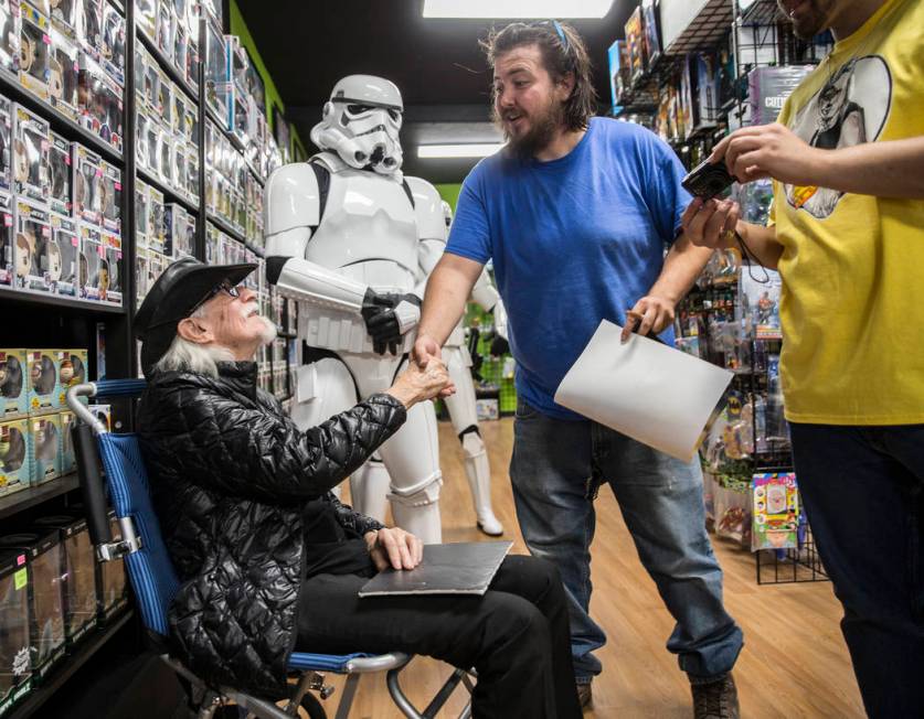 Colin Cantwell, left, concept artist and model builder for the original Star Wars movies, shake ...