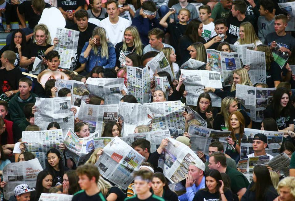 Palo Verde students hold up newspapers as Coronado players are introduced at the start of the C ...