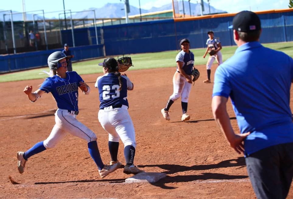 McQueen's Rylie Miller (9) gets tagged out by Shadow Ridge's Alexis Toia (23) during the second ...