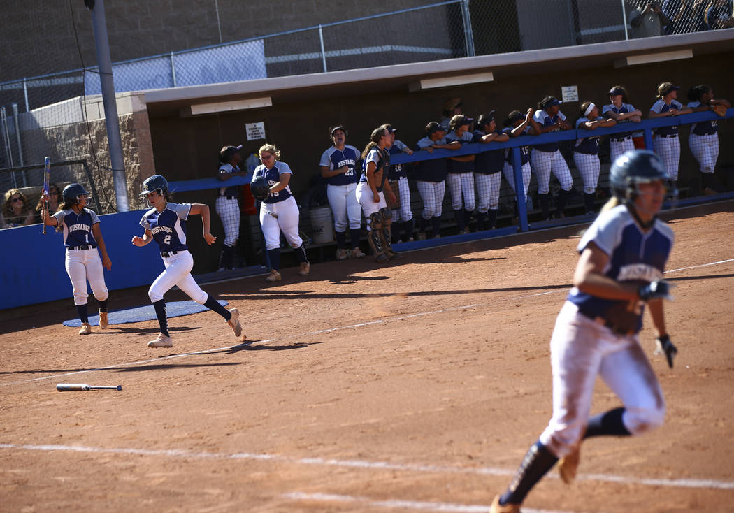 Shadow Ridge's Jasmine Payne (2) heads to home plate to score a run against McQueen during the ...