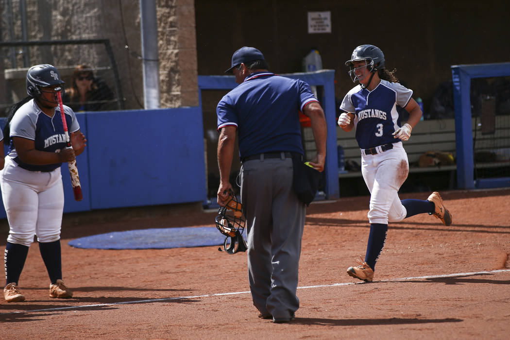 Shadow Ridge's Caitlin Covington (3) heads to home plate on her home run against McQueen during ...