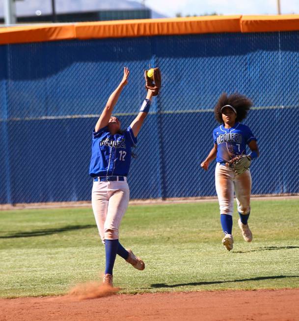 McQueen's Kiera Escalante (12) catches a fly ball from Shadow Ridge's Shea Clements, not pictur ...