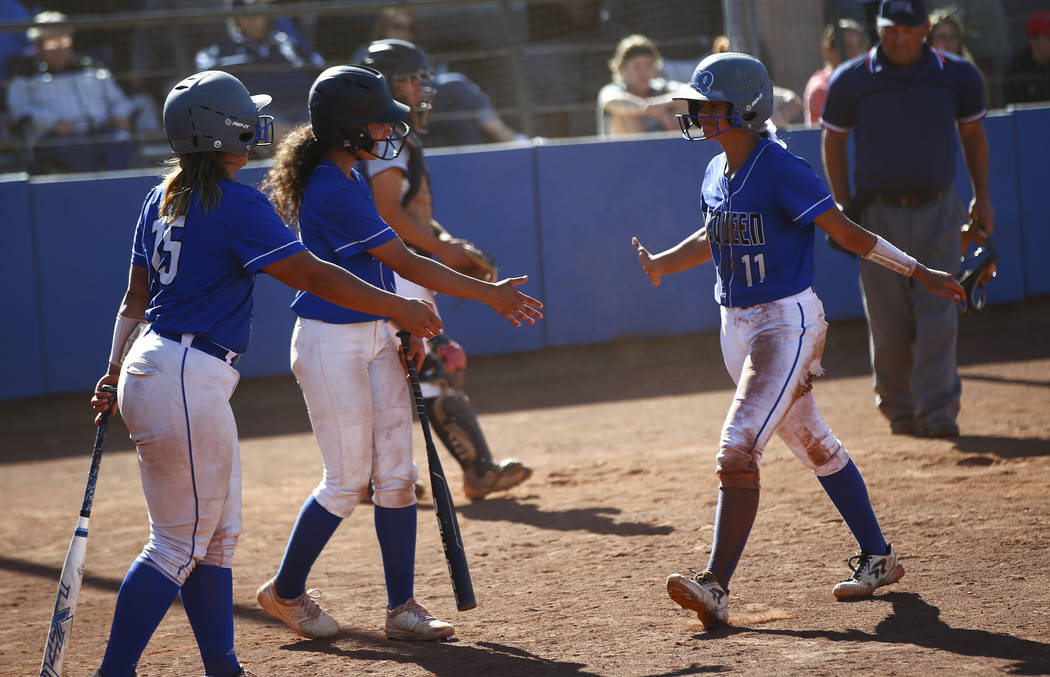 McQueen's Makayla Webber (11) celebrates her run with teammates while playing against Shadow Ri ...