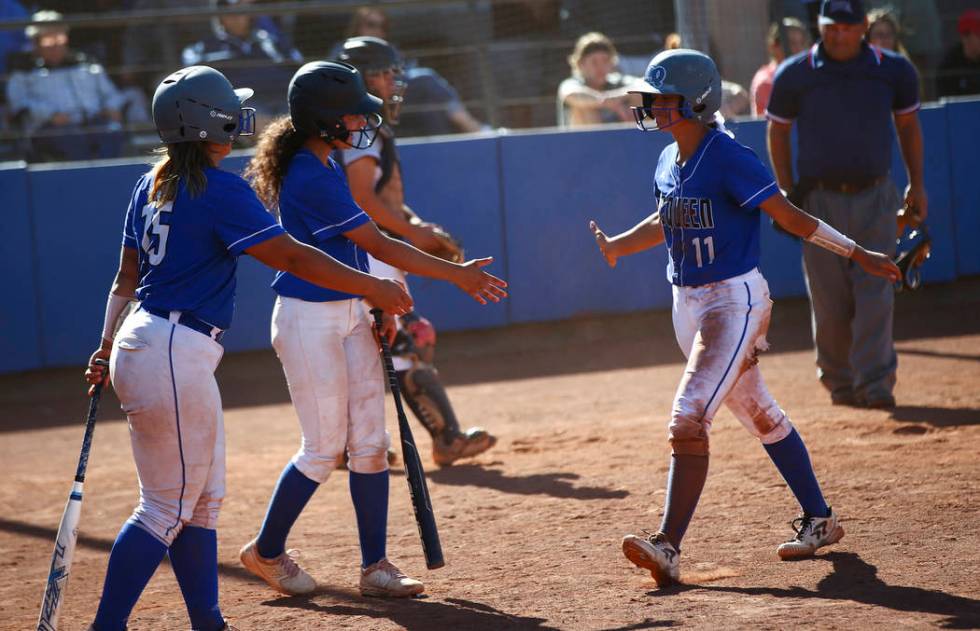 McQueen's Makayla Webber (11) celebrates her run with teammates while playing against Shadow Ri ...