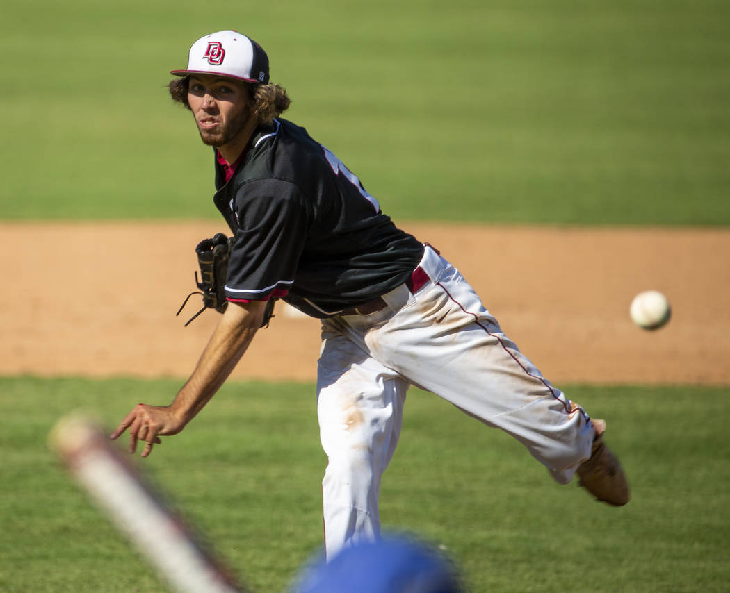 Desert Oasis pitcher Campbell Holt (15) throws to a Reno batter during their Class 4A state bas ...