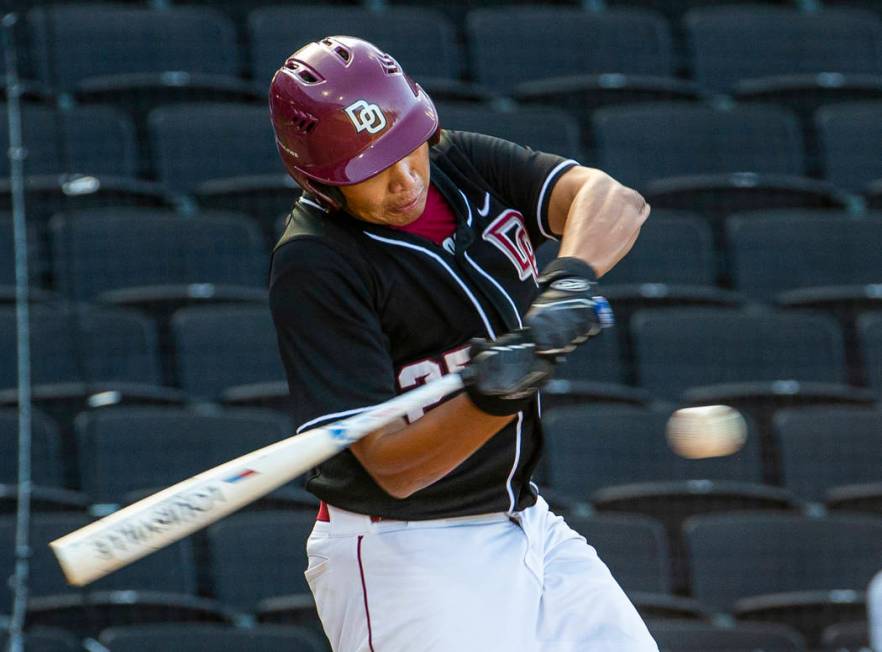 Desert Oasis' Aaron Roberts (25) eyes a pitch from Reno during their Class 4A state baseball to ...