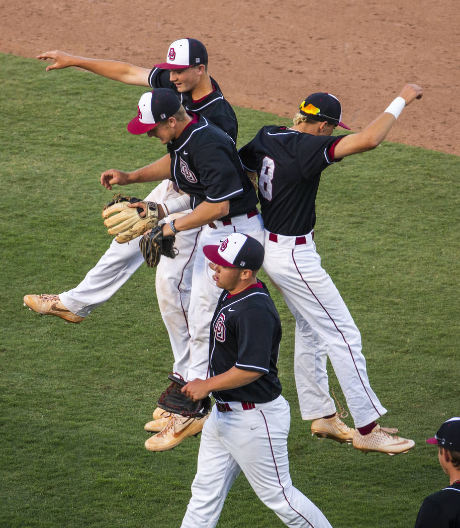 Desert Oasis players celebrate their win over Reno 8-6 following their Class 4A state baseball ...