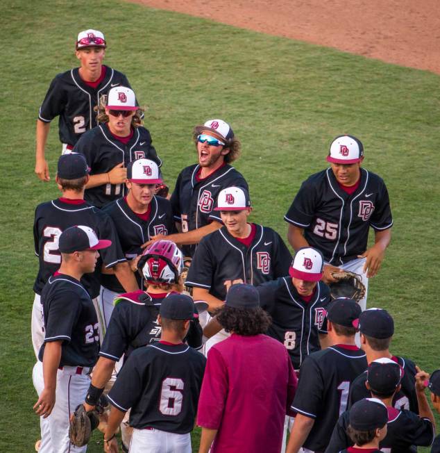 Desert Oasis players celebrate their win over Reno 8-6 following their Class 4A state baseball ...