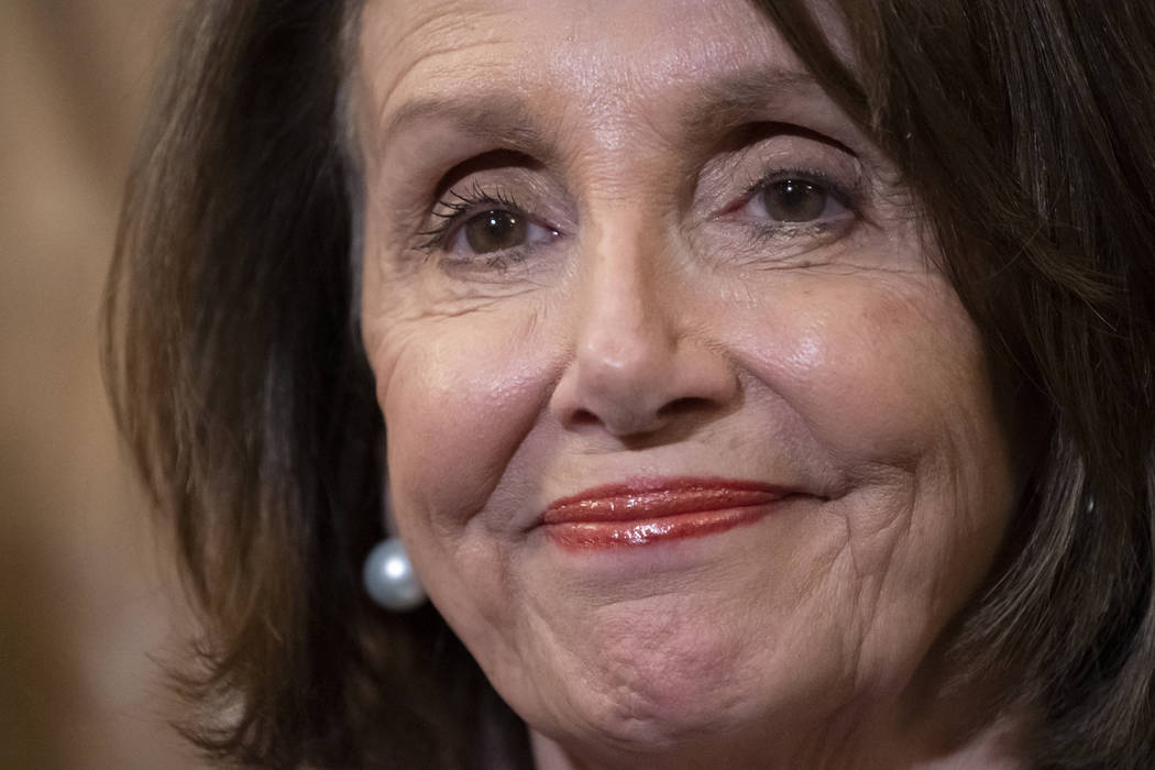 House Speaker Nancy Pelosi, D-Calif., stands at a Democratic event ahead of a House floor vote ...