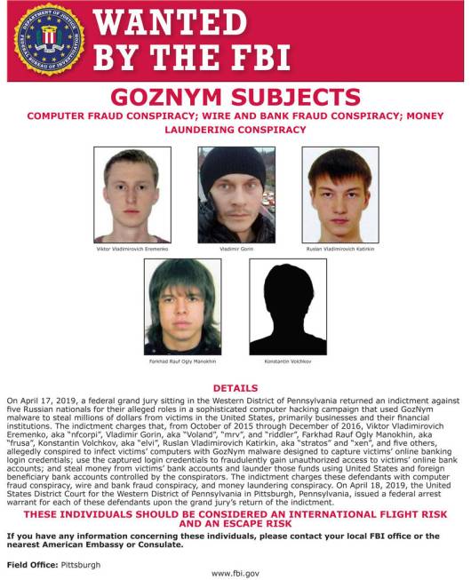 This undated poster released by the FBI includes five Russian fugitives that have been charged ...