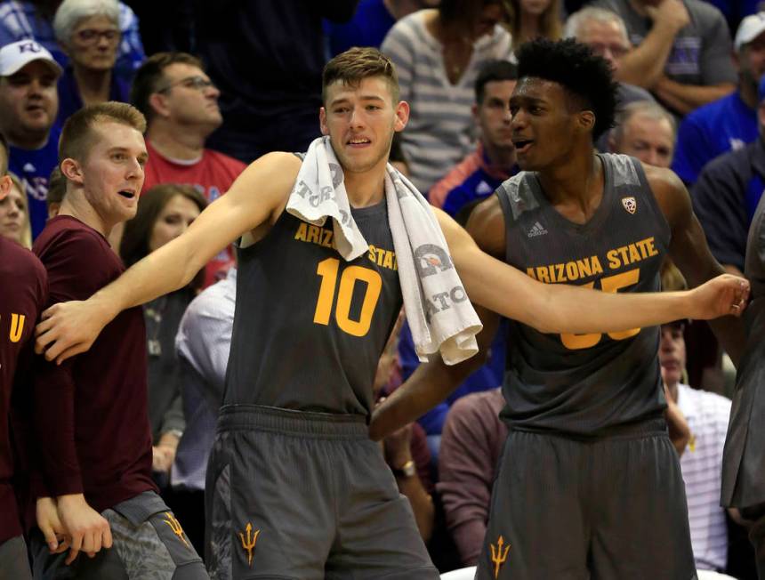 Arizona State forward Vitaliy Shibel (10) holds back a bench celebration during the second half ...