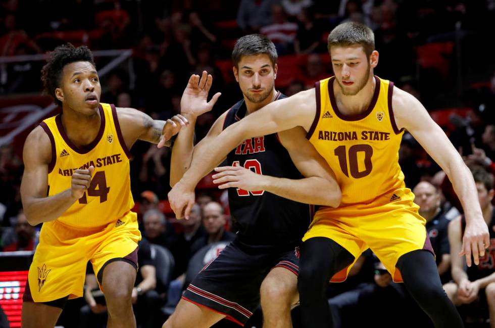 Arizona State's Kimani Lawrence (14) and Vitaliy Shibel (10) compete with Utah's Novak Topalovi ...