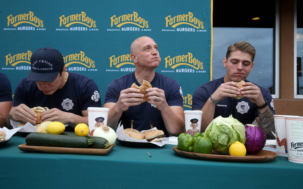 Las Vegas firefighters from left, Toby Brown, Allen McFall and Kelby Lytle compete against Clar ...