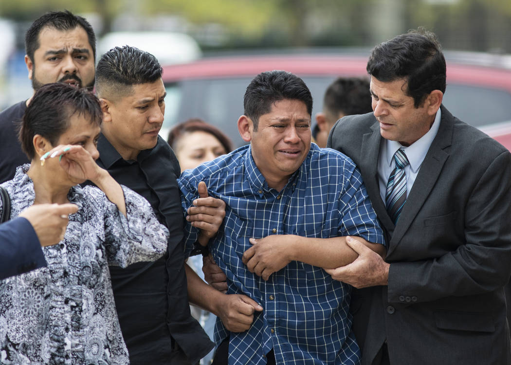 Arnulfo Ochoa, the father of Marlen Ochoa-Lopez, is surrounded by family members and supporters ...