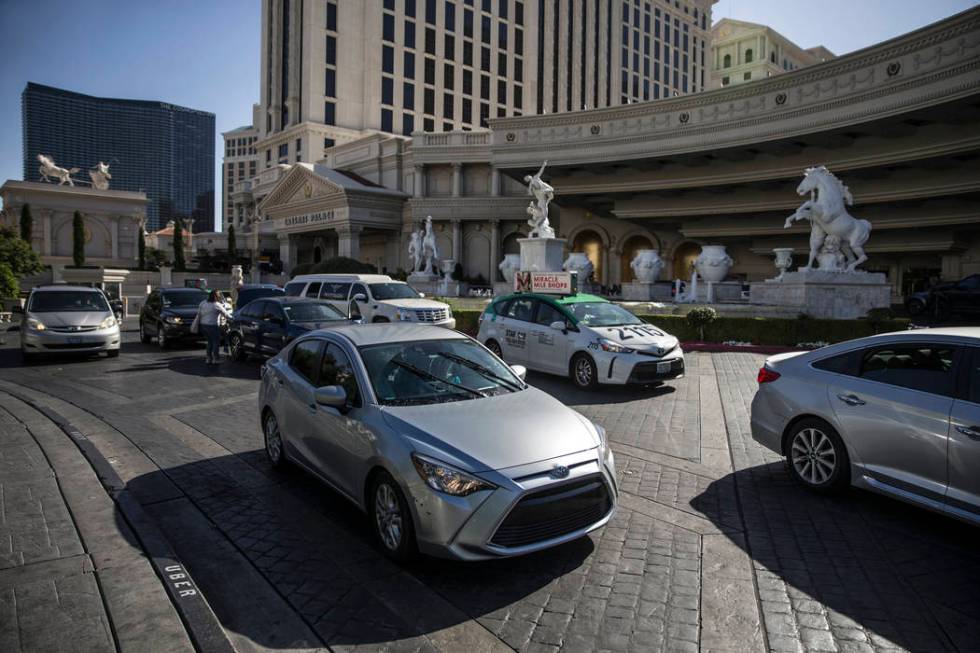 Cars exit the main entrance at Caesars Palace on Thursday, May 16, 2019, in Las Vegas. (Las Veg ...
