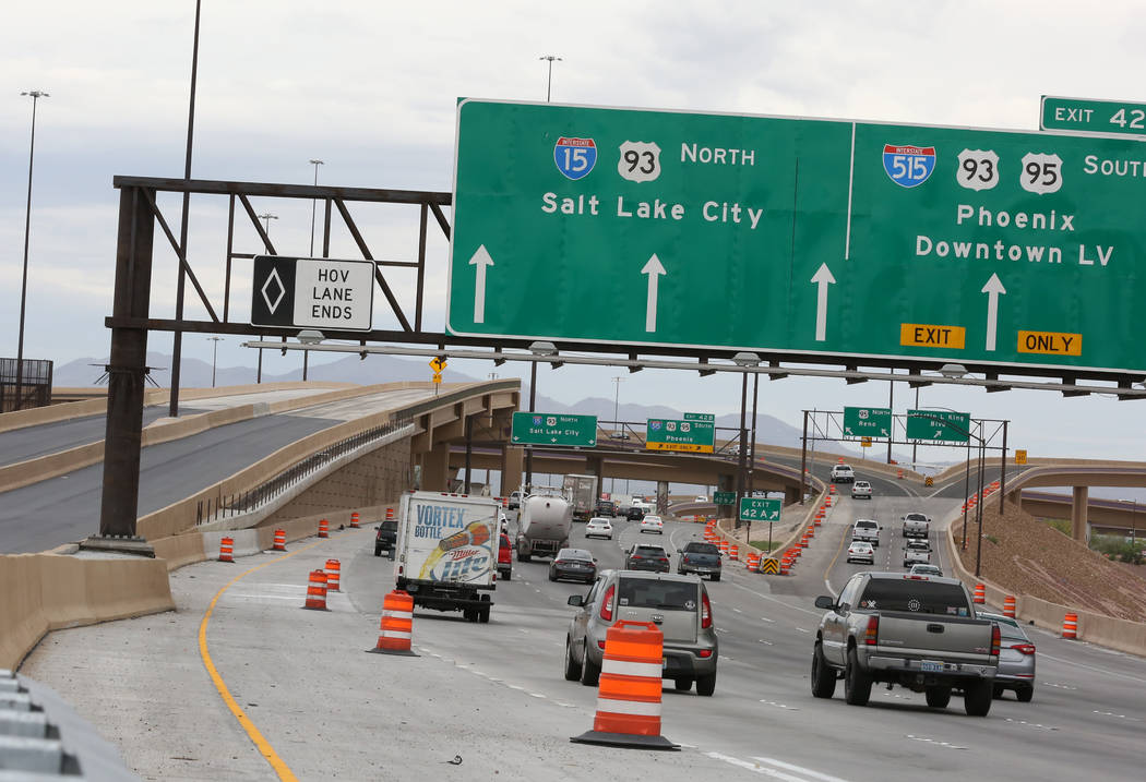 The newly completed Project Neon HOV flyover ramp in the Spaghetti Bowl, left, is seen on Thurs ...