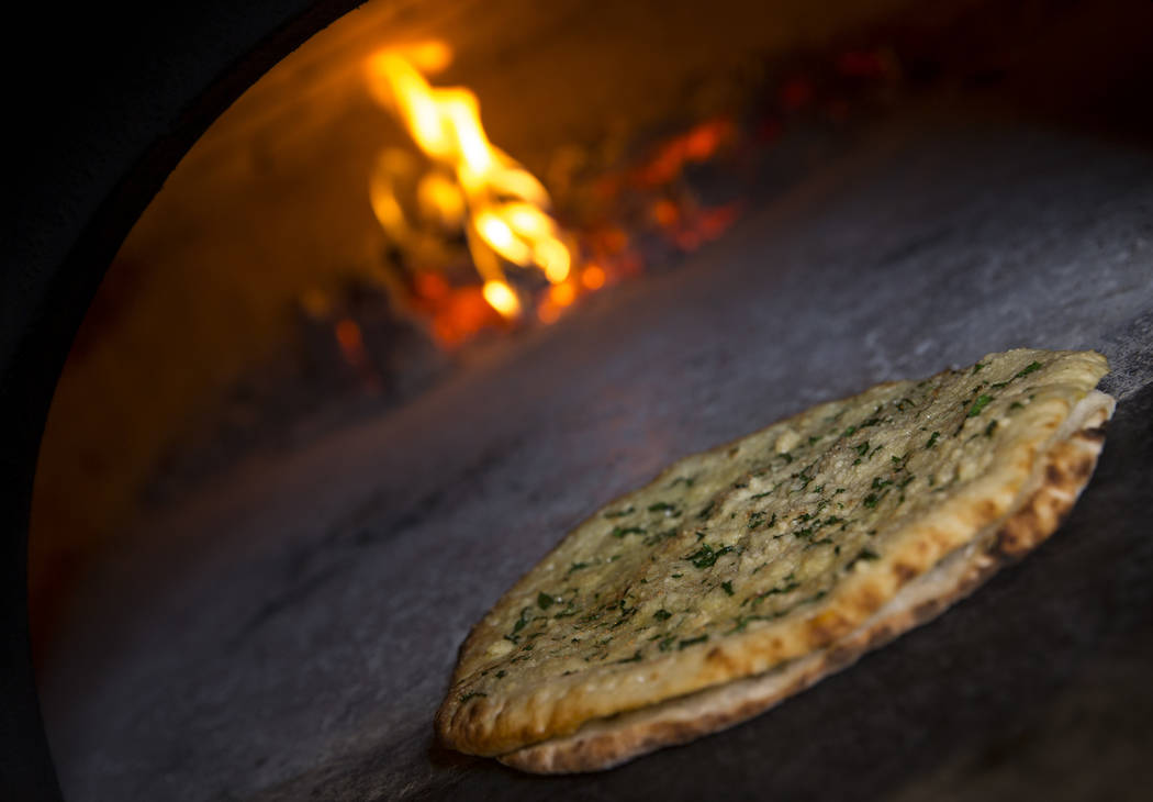 Recco style garlic bread in a wood fired oven at Masso Osteria inside Red Rock Casino in Las Ve ...