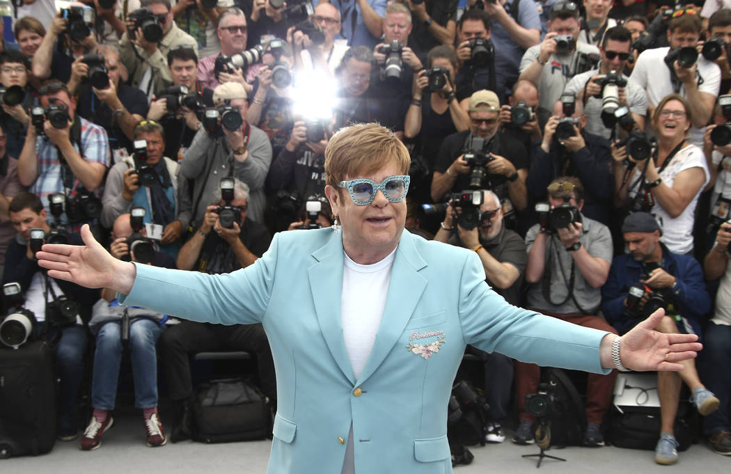 Singer Elton John poses for photographers at the photo call for the film 'Rocketman' at the 72n ...