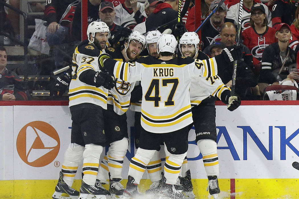 Boston Bruins' Patrice Bergeron (37) David Pastrnak, second from left, Brad Marchand (63), Jake ...