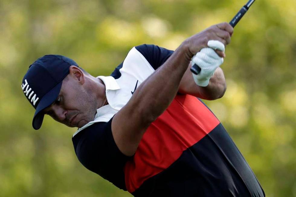 Brooks Koepka hits a drive off the 13th tee during the first round of the PGA Championship golf ...