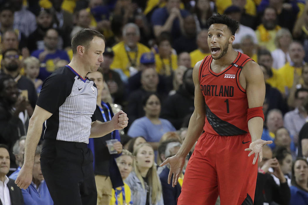 Portland Trail Blazers guard Evan Turner (1) gestures while talking to an official during the s ...