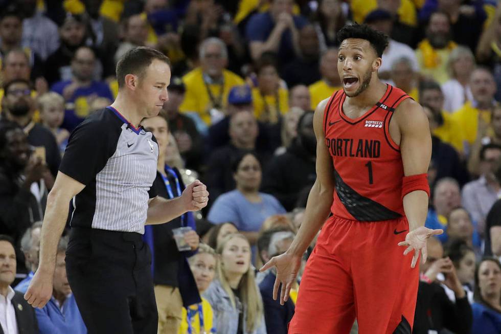 Portland Trail Blazers guard Evan Turner (1) gestures while talking to an official during the s ...