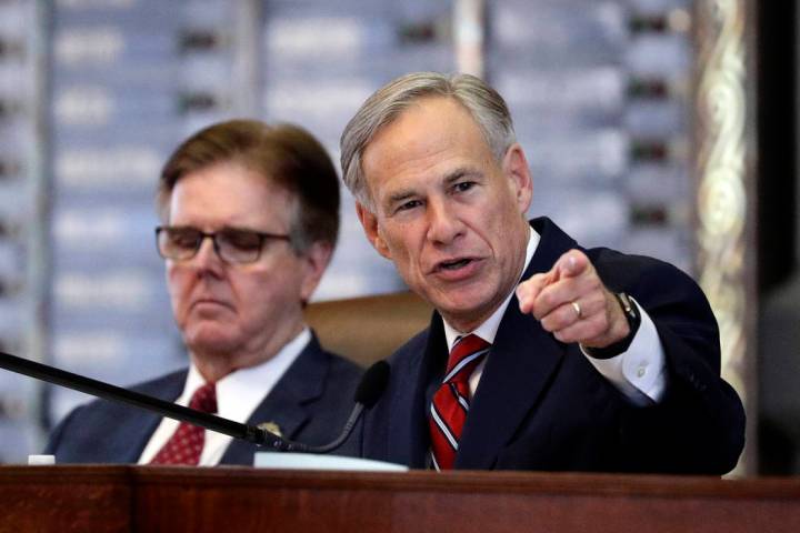 Texas Gov. Greg Abbott, right, gives his State of the State address Feb. 5, 2019, as Lt. Gov. D ...