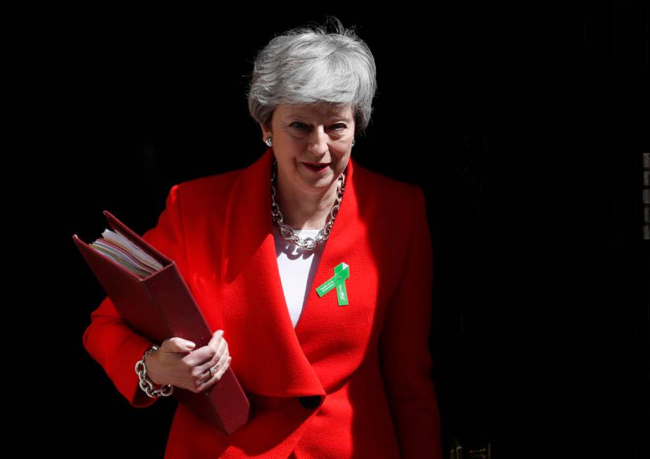 Britain's Prime Minister Theresa May leaves 10 Downing Street for her weekly Prime Minister's Q ...