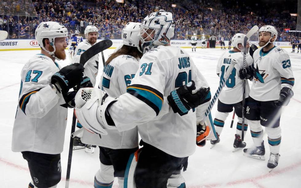 San Jose Sharks goaltender Martin Jones (31) celebrates with Joakim Ryan (47) and Erik Karlsson ...