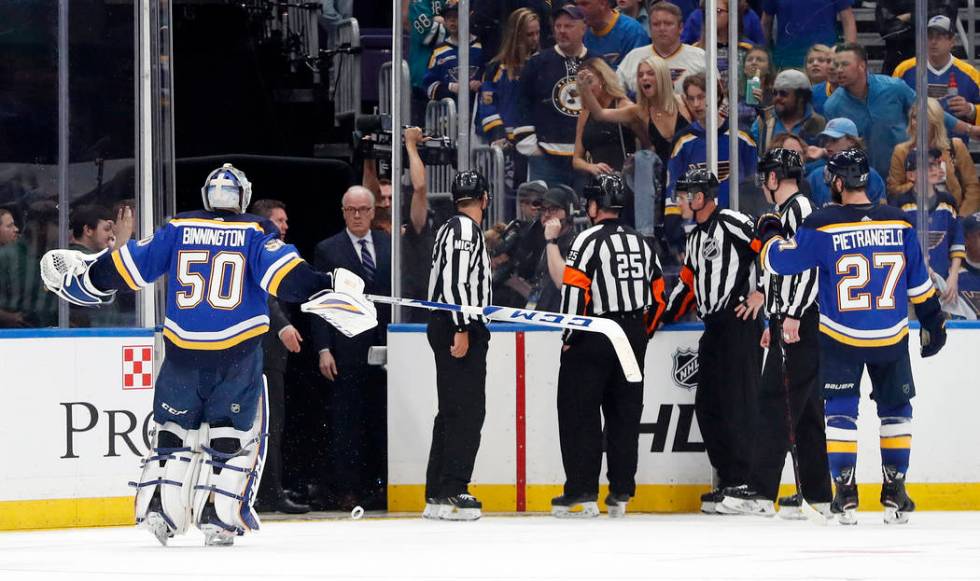 St. Louis Blues goaltender Jordan Binnington (50) and defenseman Alex Pietrangelo (27) argue ag ...