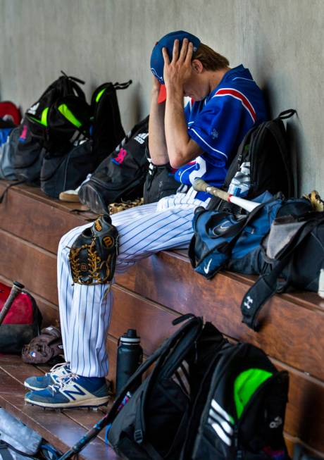 Reno pitcher John Barry (2) gets his head straight in the dugout versus Desert Oasis in the fou ...