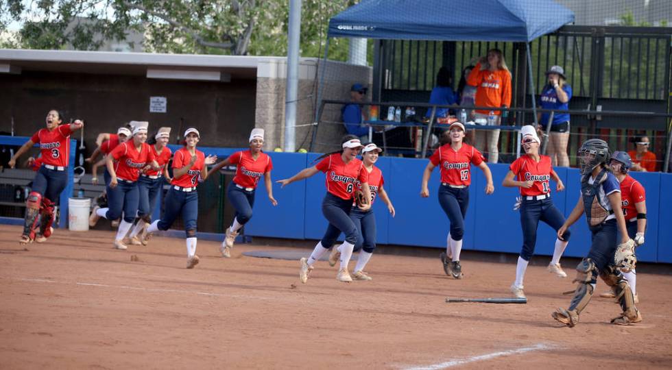 Coronado players celebrate a two-run home run by Kaila Angel (9) against Shadow Ridge in their ...