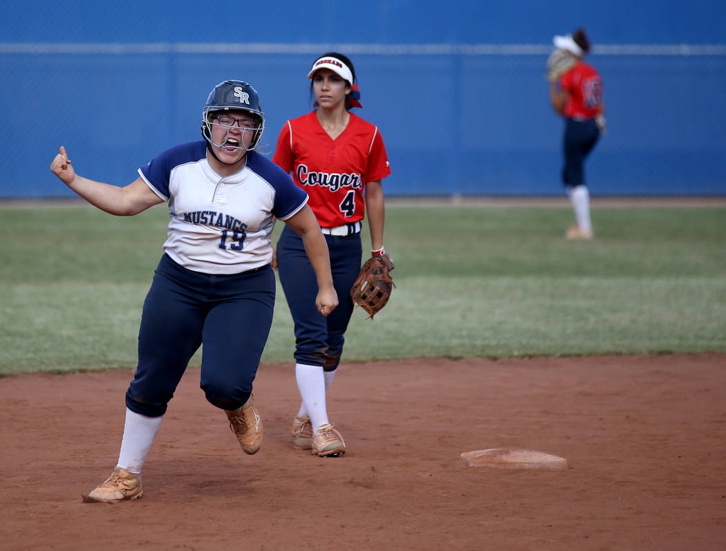 Shadow Ridge Sydney Morgan (19) celebrates her three-run home run against Coronado in their Cla ...