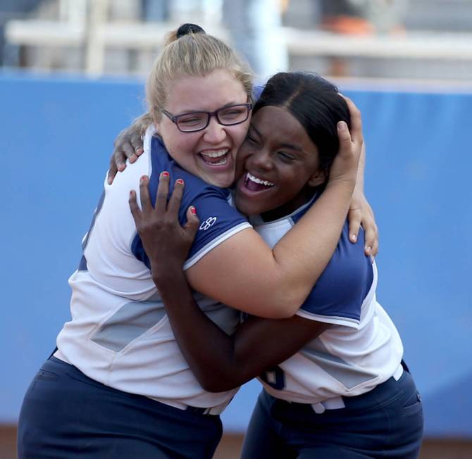 Shadow Ridge's Sydney Morgan (19), left, and Jasmine Martin (8) celebrate beating Coronado in t ...