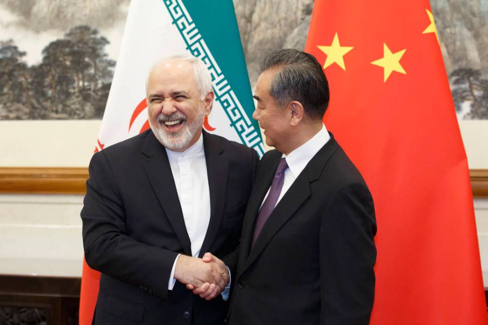 Chinese Foreign Minister Wang Yi meets Iranian Foreign Minister Mohammad Javad Zarif at the Dia ...
