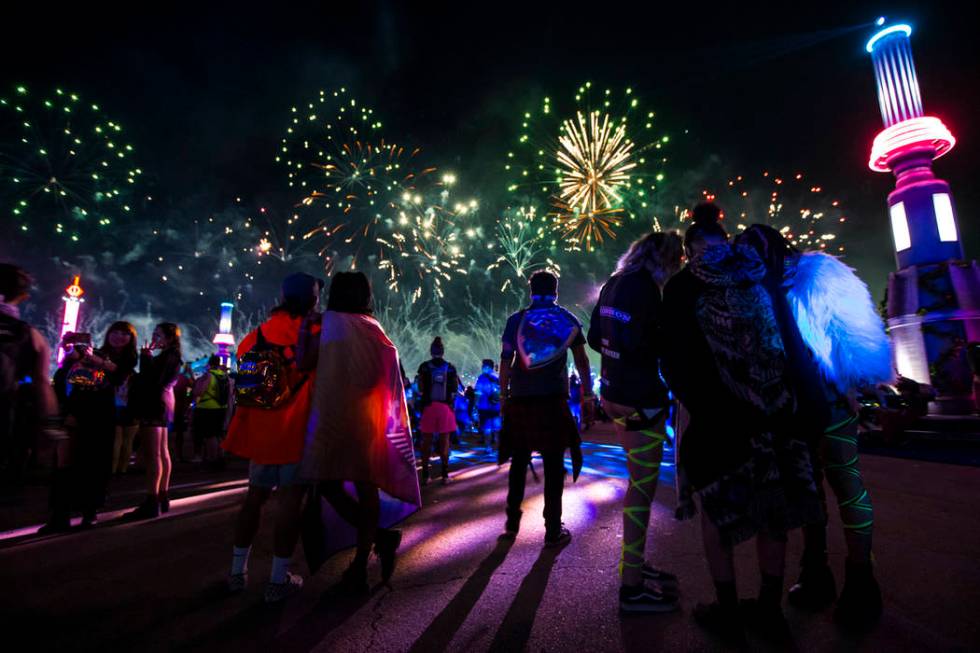 Attendees watch fireworks go off during the first day of the Electric Daisy Carnival at the Las ...