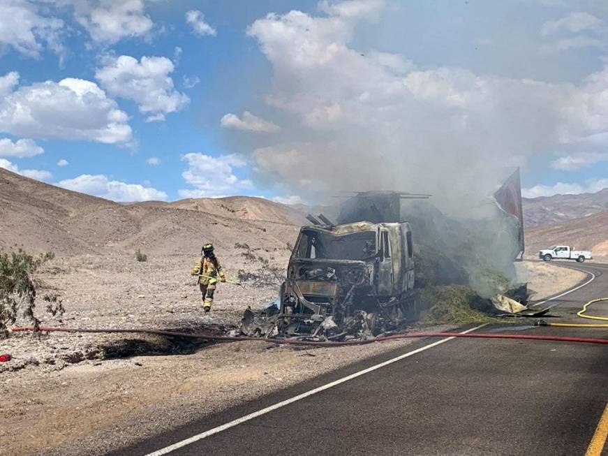 A hay truck burns in Death Valley National Park after the driver took a wrong turn and drove do ...