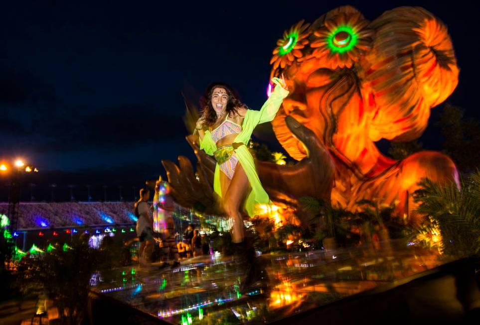 Sofia Alengoz, of Las Vegas, dances by the Anima installation during the second day of the Elec ...