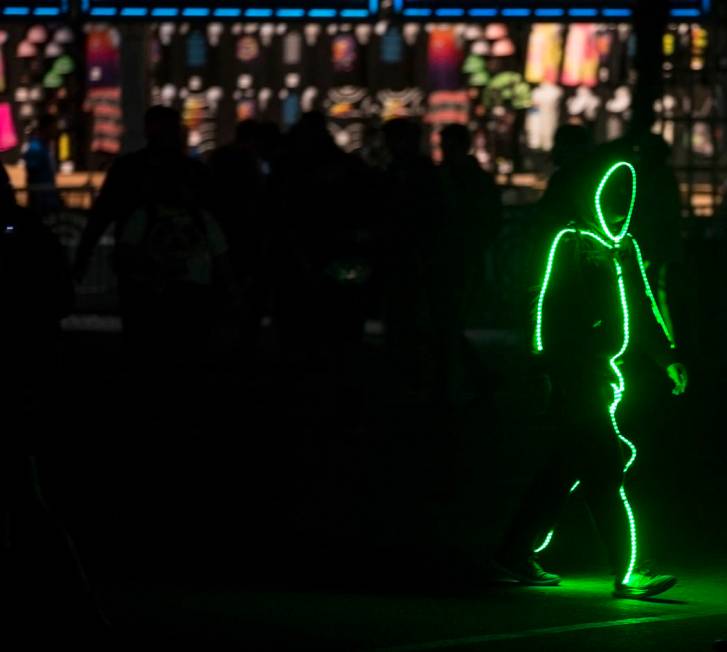 A neon shadow makes his way to the Cosmic Meadow stage during day two of Electric Daisy Carniva ...