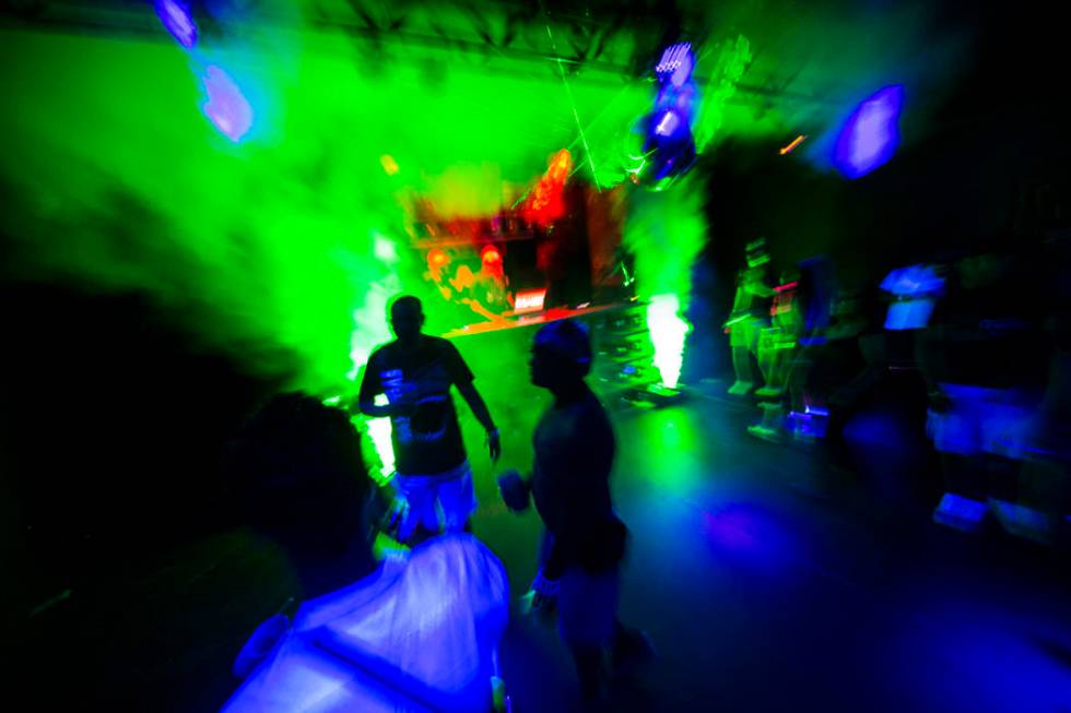 Attendees dance at the Headlight in Downtown EDC during the second day of the Electric Daisy Ca ...