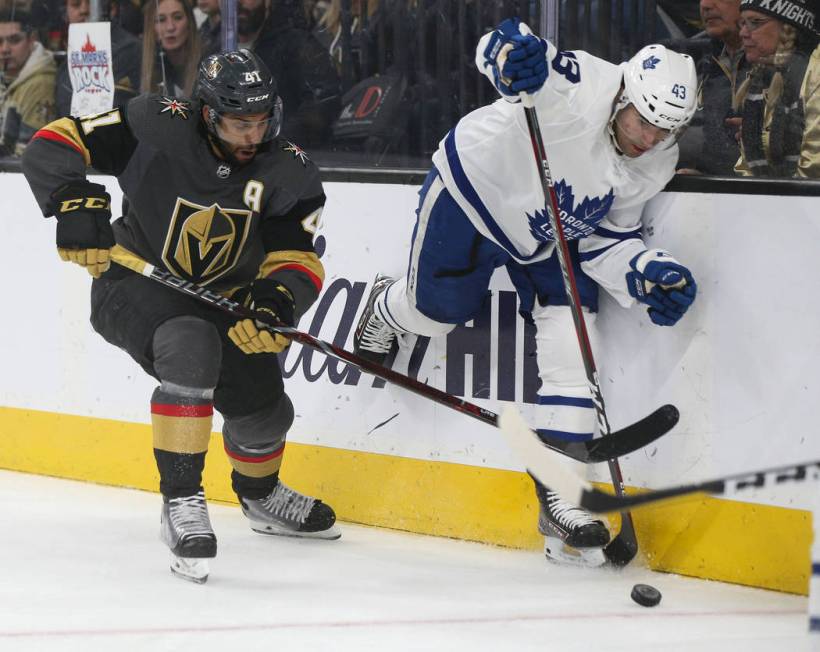 Vegas Golden Knights center Pierre-Edouard Bellemare (41) and Toronto Maple Leafs center Nazem ...