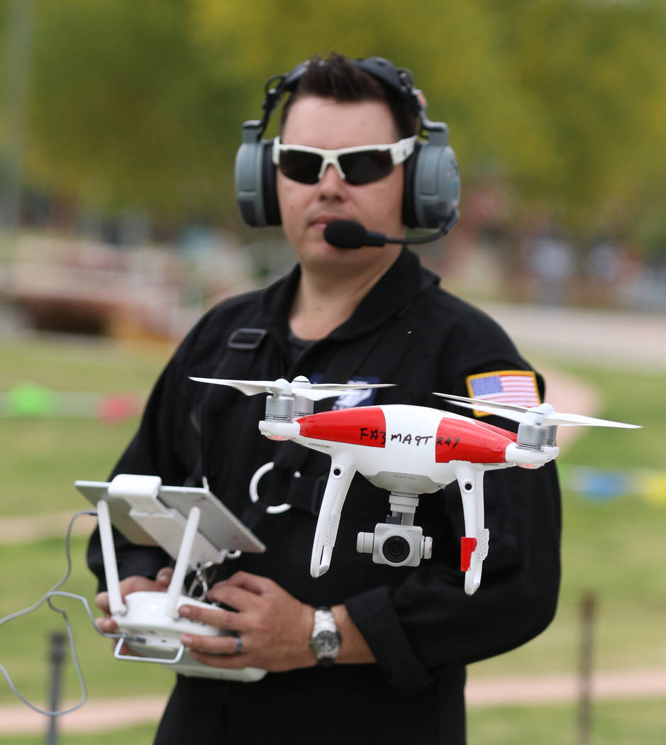 Jason Daub, a pilot in command, flies his Phantom IV drone over Craig Ranch Park on Friday, May ...