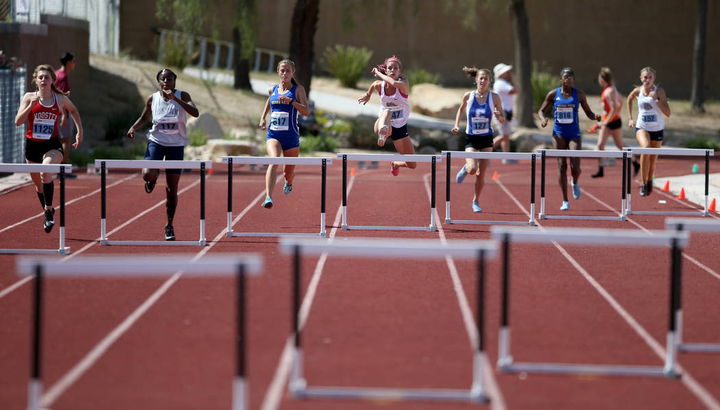 Quincy Bonds Centennial, center, on her way to winning Class 4A 300 meter hurdles in the state ...