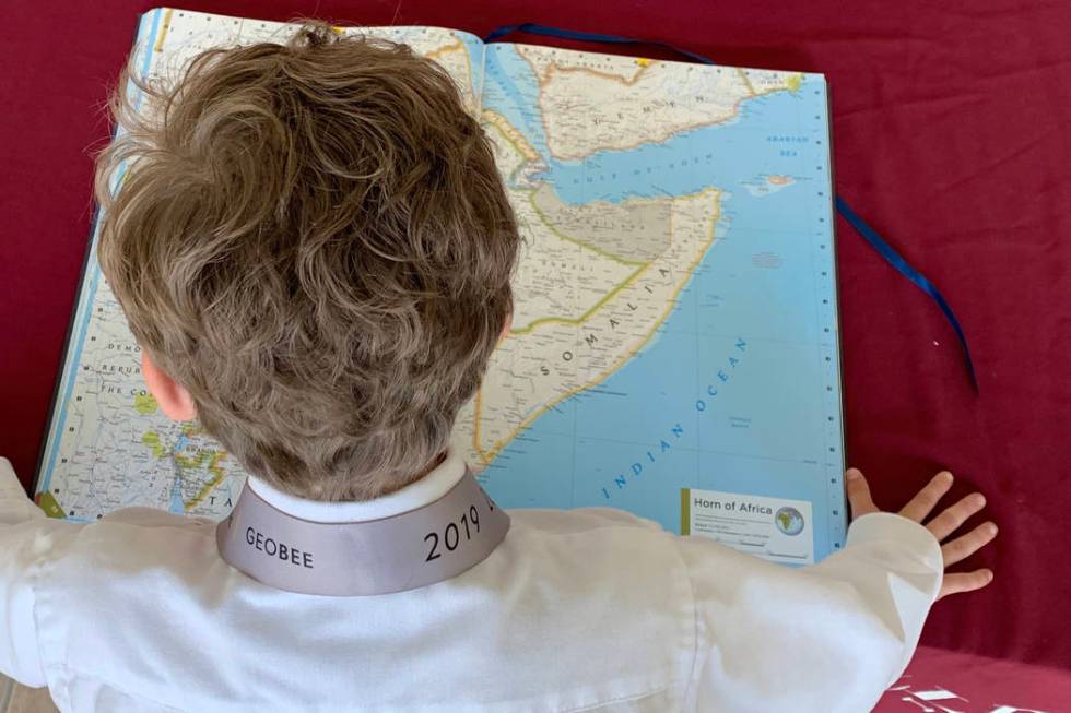 Jack Stark studies an atlas at Challenger School-Summerlin on May 15. (Mia Sims, Las Vegas Revi ...