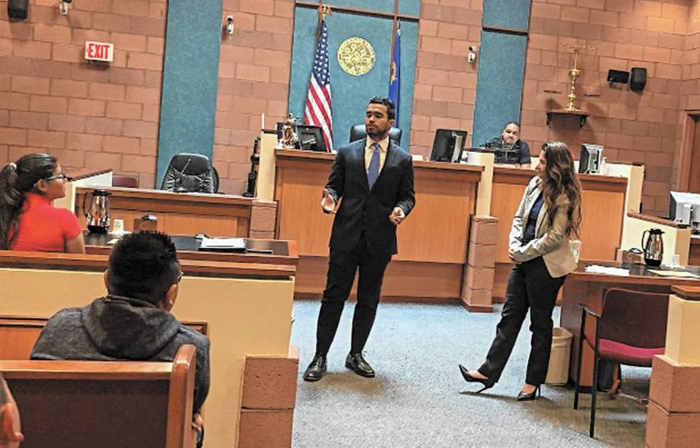 Julio Garcia, left, and Jen Smith, both graduating students at Boyd School of Law at UNLV, spea ...