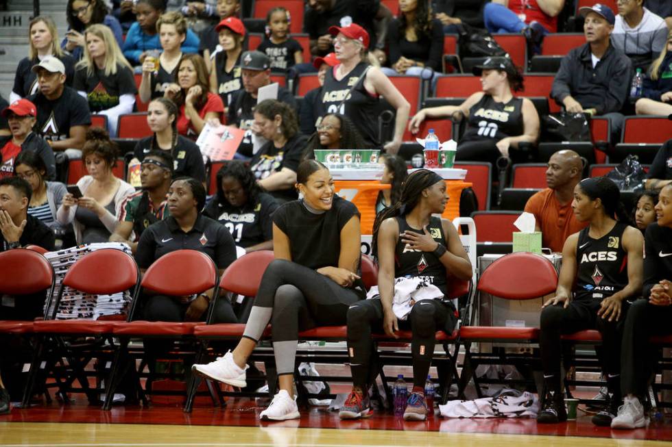 Liz Cambage, who was recently traded to the Aces from the Dallas Wings, watches the preseason g ...