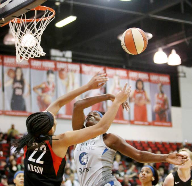 Las Vegas Aces A'ja Wilson (22) knocks the ball out of the hands of Minnesota Lynx Sylvia Fowle ...