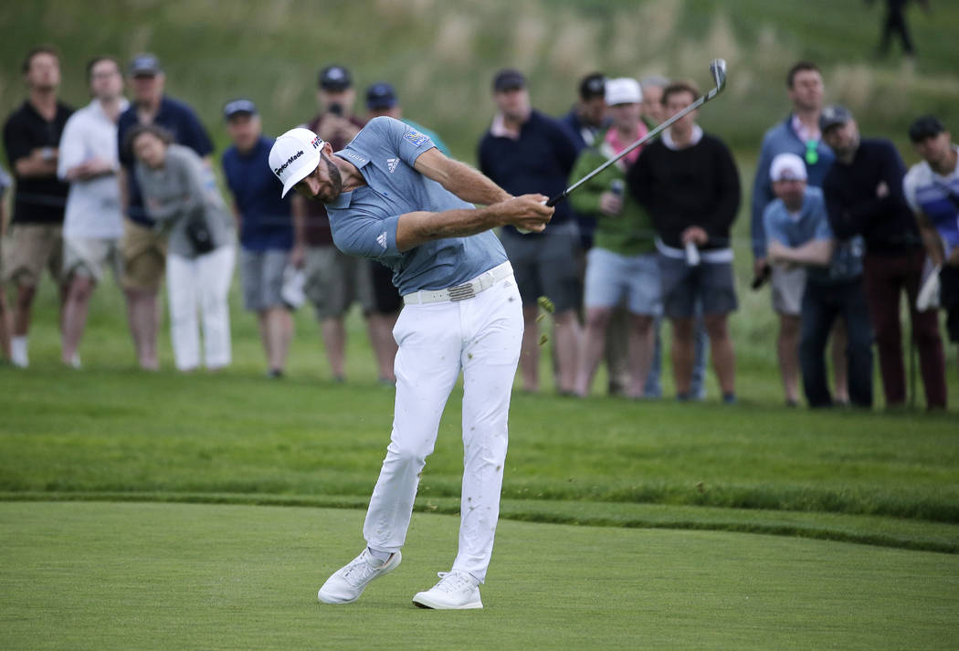 Dustin Johnson hits off the 17th fairway during the final round of the PGA Championship golf to ...