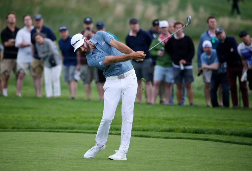 Dustin Johnson hits off the 17th fairway during the final round of the PGA Championship golf to ...