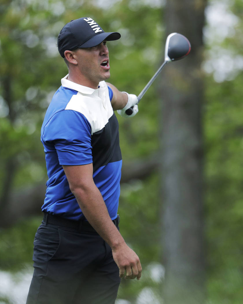 Brook Koepka reacts to his shot off the 12th tee during the final round of the PGA Championship ...